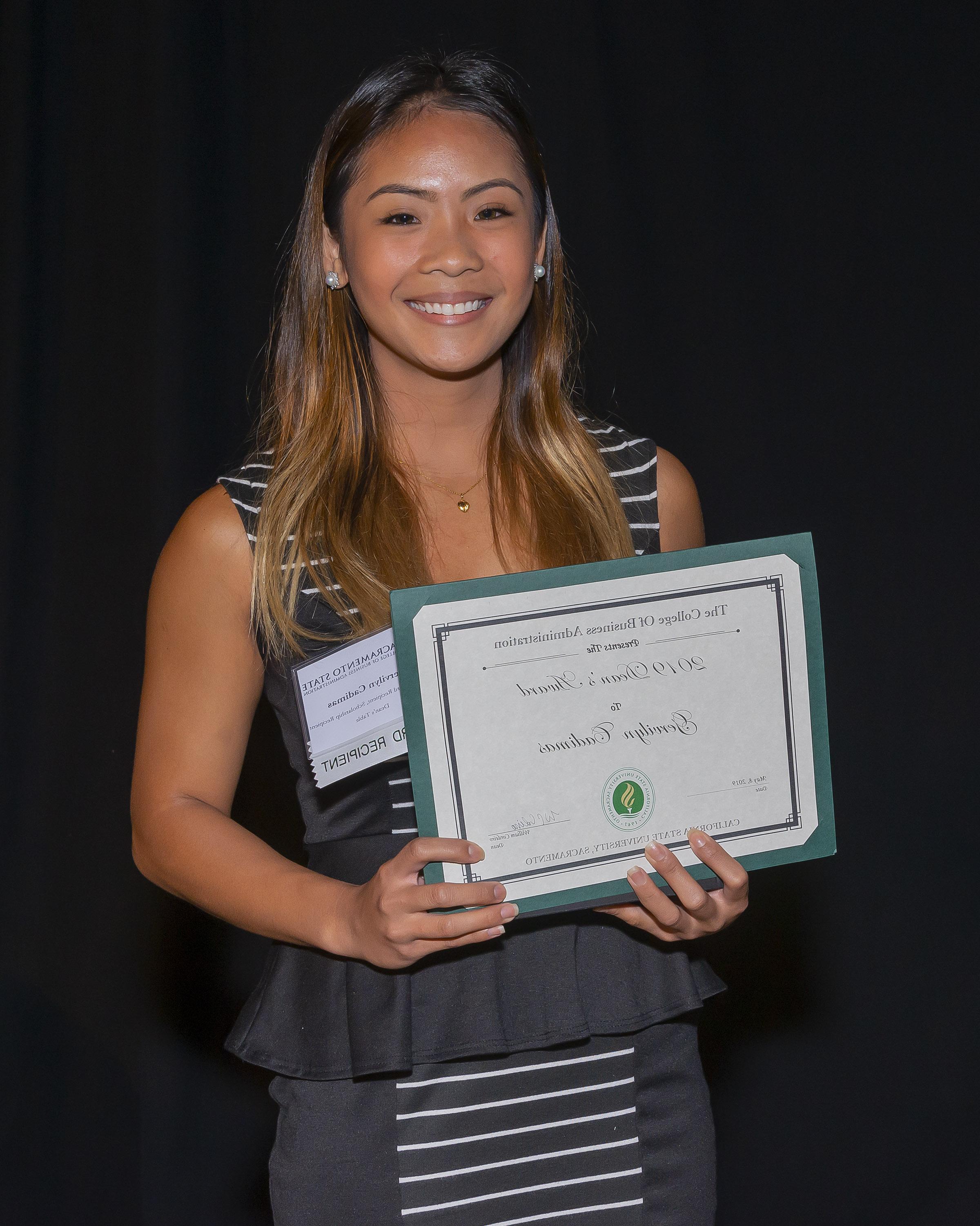 Photo of student holding a certificate